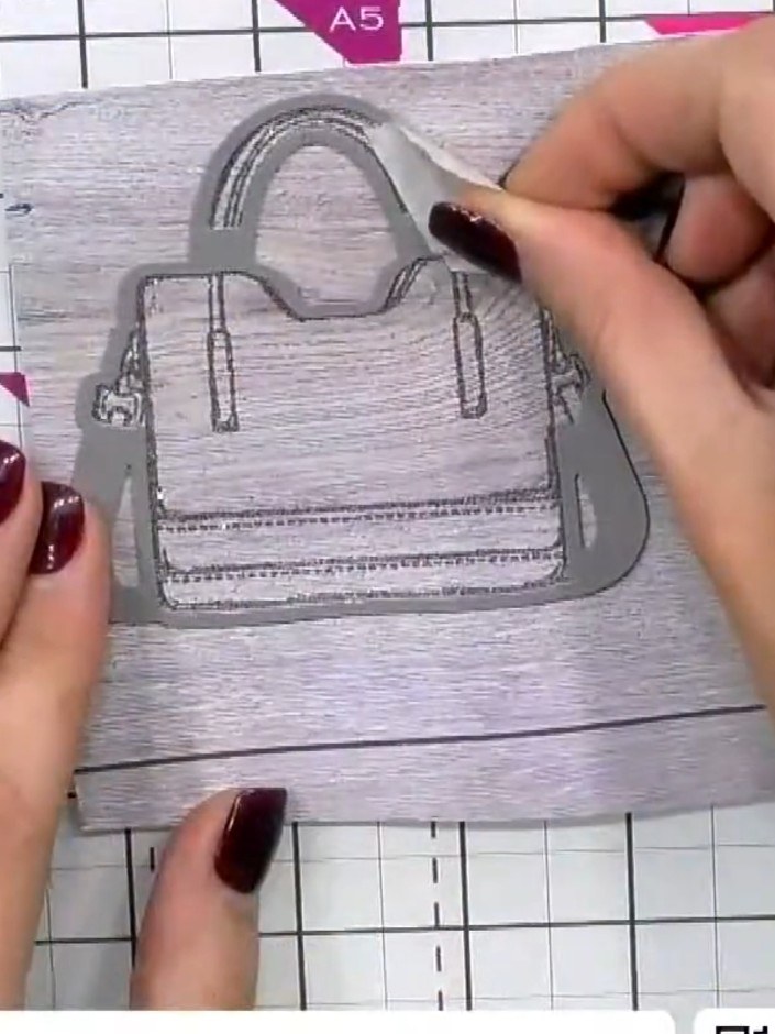 Step 7: If desired, line up the stamped handbag embellishment in the 3D embossing folder and run through the die-cutti