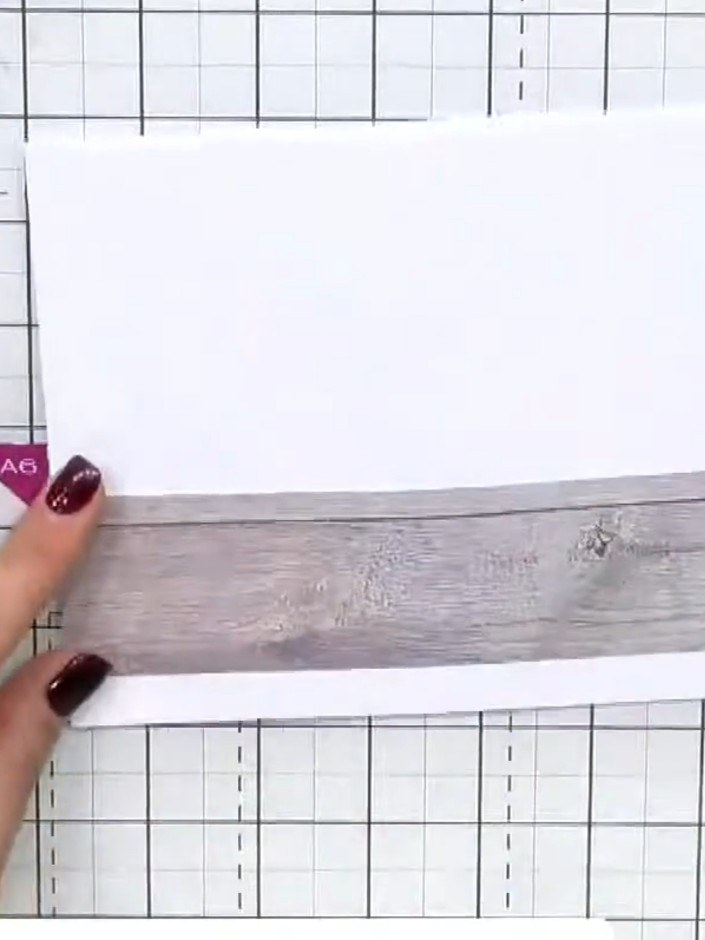 Step 1: Create a side-fold card base from white cardstock. Cut a piece of wood-panel patterned paper and adhere it to 