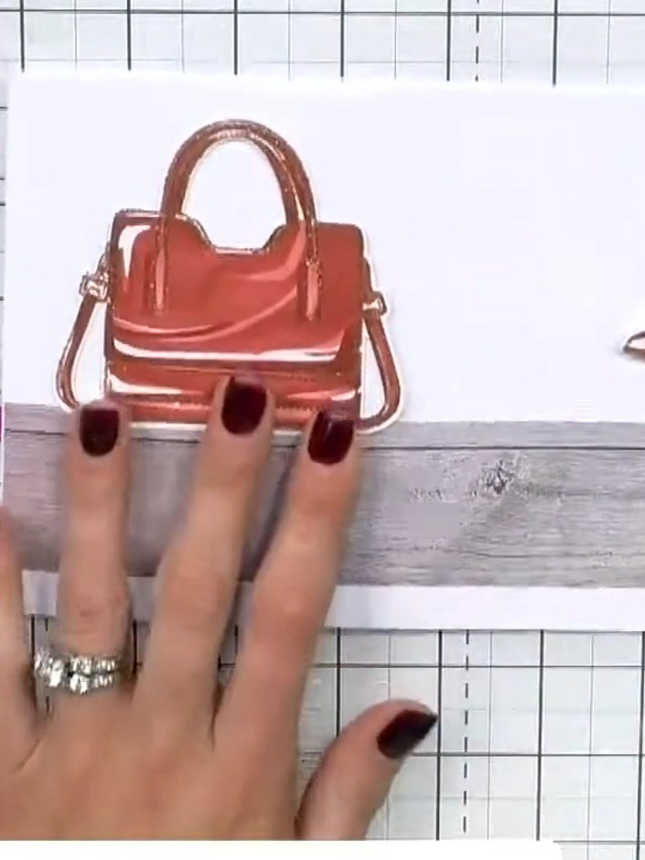 Step 3: Position your completed shoe embellishments next to the handbag on the shelf panel, arranging them as if they 
