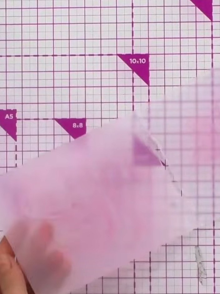 Step 2: Apply pink ink across both the top and bottom sides of your embossing folder using a Distress Ink pad. Ensure 