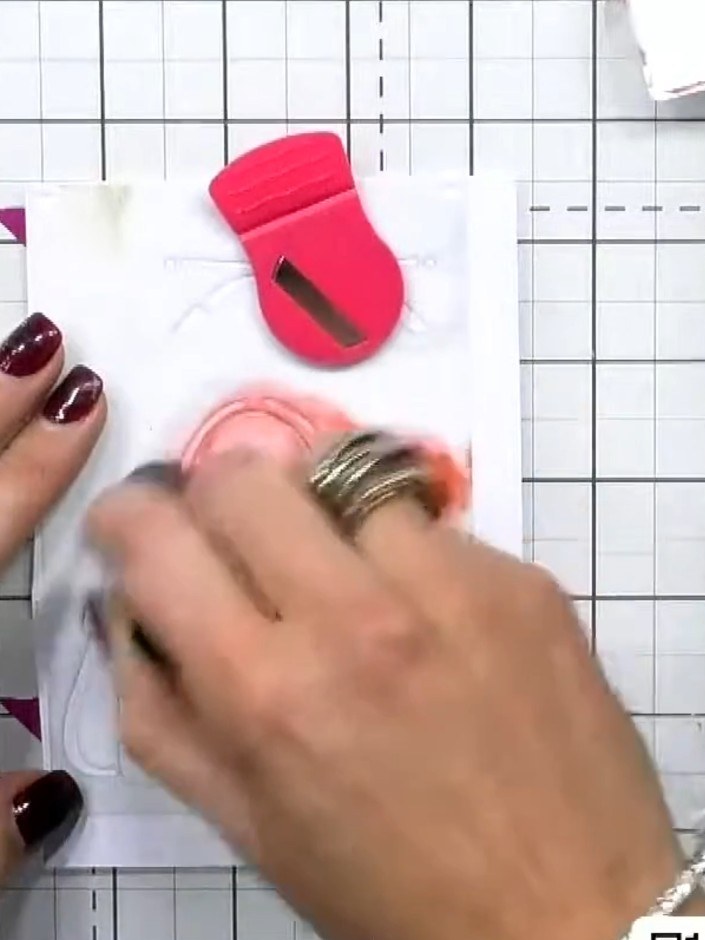 Step 2: Position the second stencil over your first inked layer, aligning it carefully. Apply a second ink colour usin