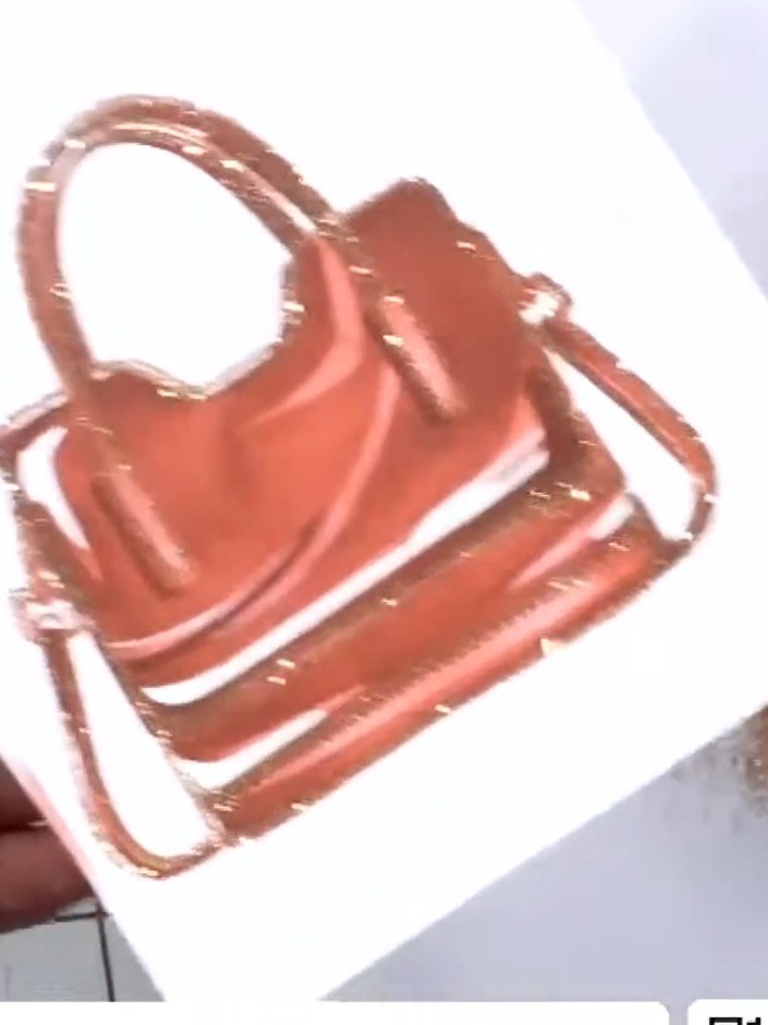 Step 8: Use the coordinating outline die to cut out your finished lipstick embellishment. This will give you a clean, 