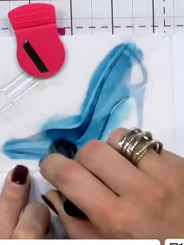 Step 4: Position stencil three over the shoe design and apply ink using the pad directly, pressing harder to create da