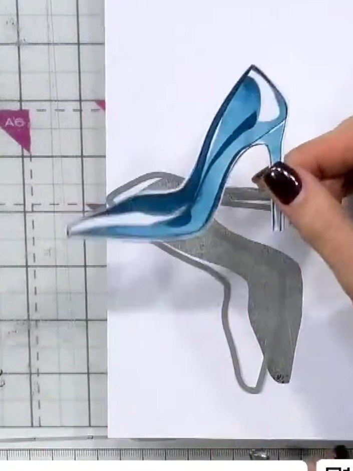 Step 8: Optional: die-cut around the blue high heel shoe using the coordinating outline die to create a shaped embelli
