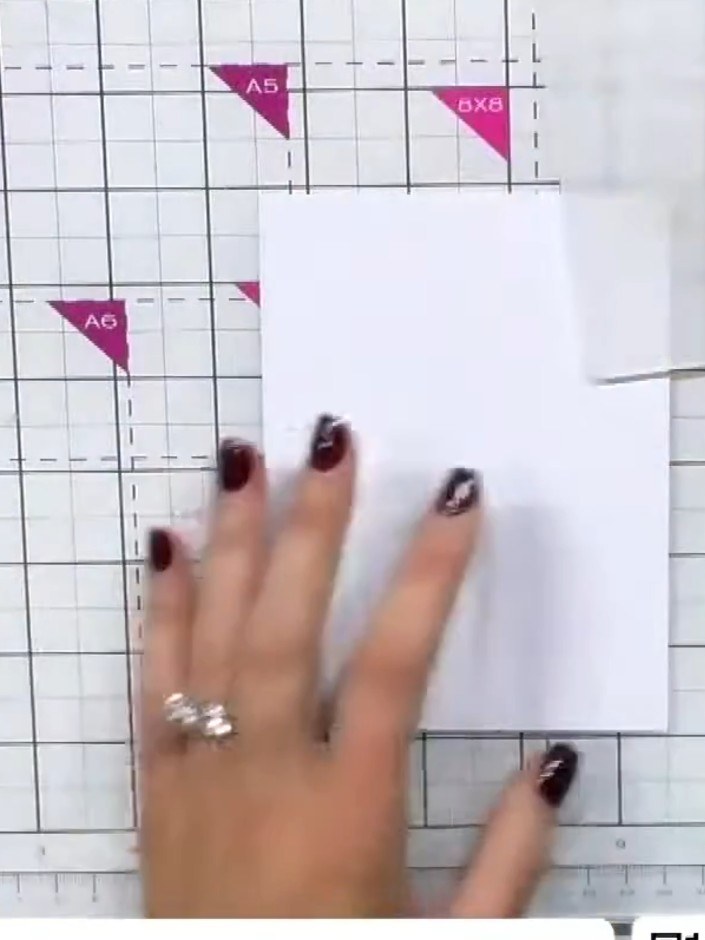 Step 1: Position stencil number one for the handbag at the top left of your white card stock, aligning it with the edg