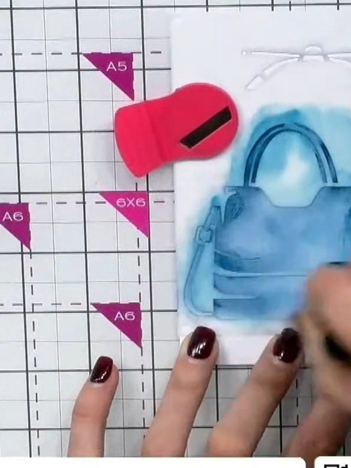 Step 3: Position the second handbag stencil, aligning it with the edge of the card. Apply the same colour ink through 