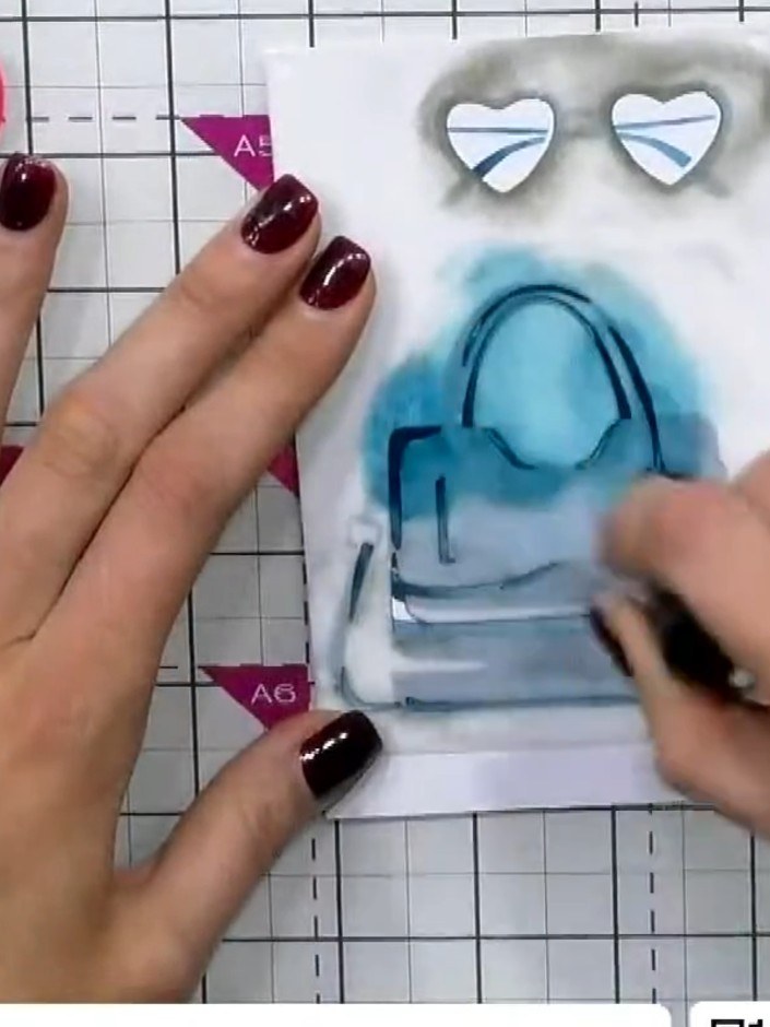 Step 7: Optional: Use the coordinating stamp to add outline detail to the handbag. Press firmly with dark ink to defin