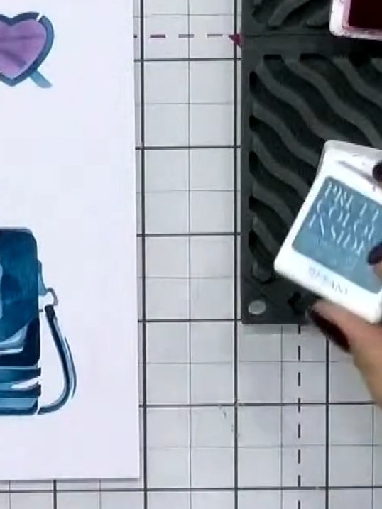 Step 8: Run the card through the 3D embossing folder to add texture and dimension to the handbag design. This will cre