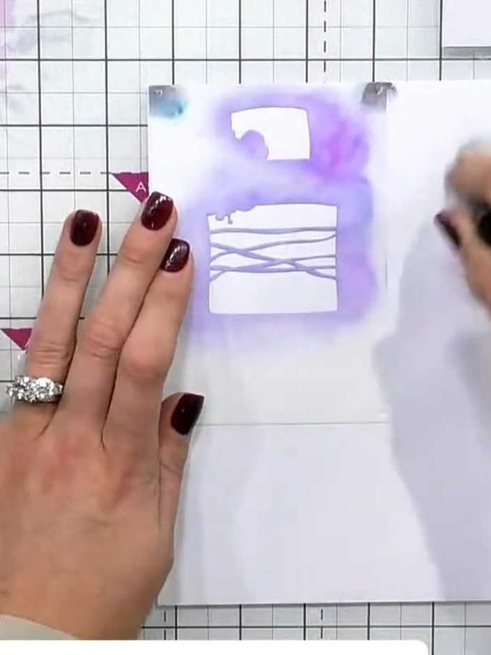 Step 2: Place stencil one over your card base. Using a sticky ink pad, press lightly through the stencil to apply the 