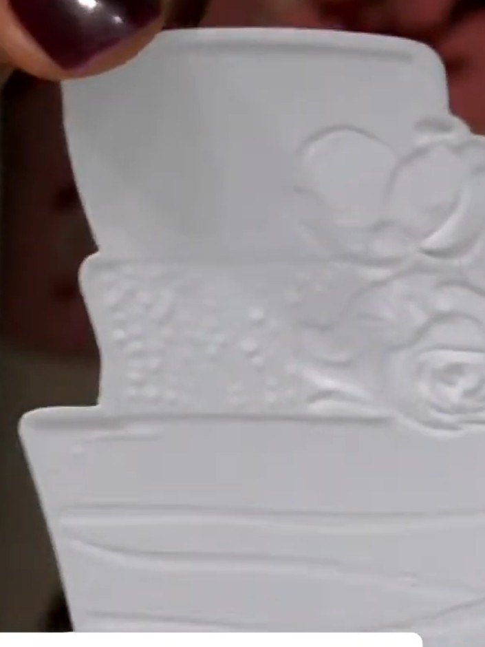 Step 8: Run the die-cut piece through the 3D embossing folder to add dimensional texture and a professional finish to 