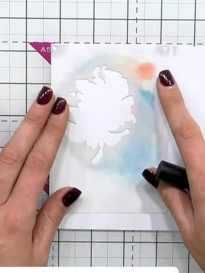 Step 2: Select a light ink colour and apply it through the first stencil layer onto your card base to create the initi