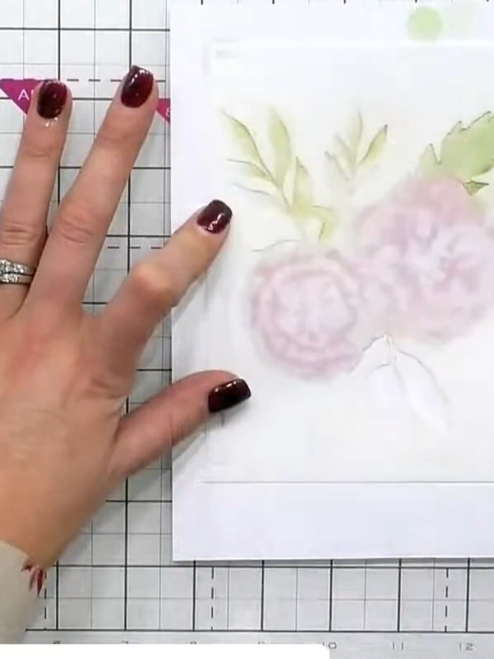 Step 5: Position stencil four over your card and apply green ink through the leaf elements using a blending tool. Keep