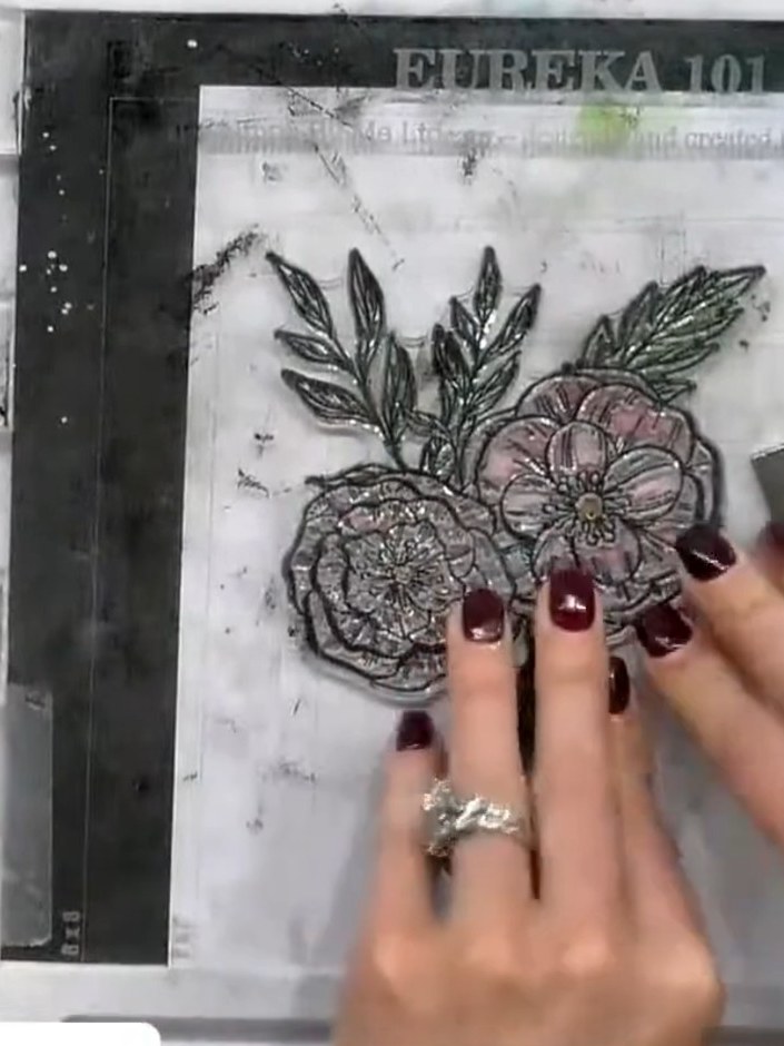 Step 6: Stamp the coordinating flower image over the stencilled design using black ink. This adds fine detail and defi