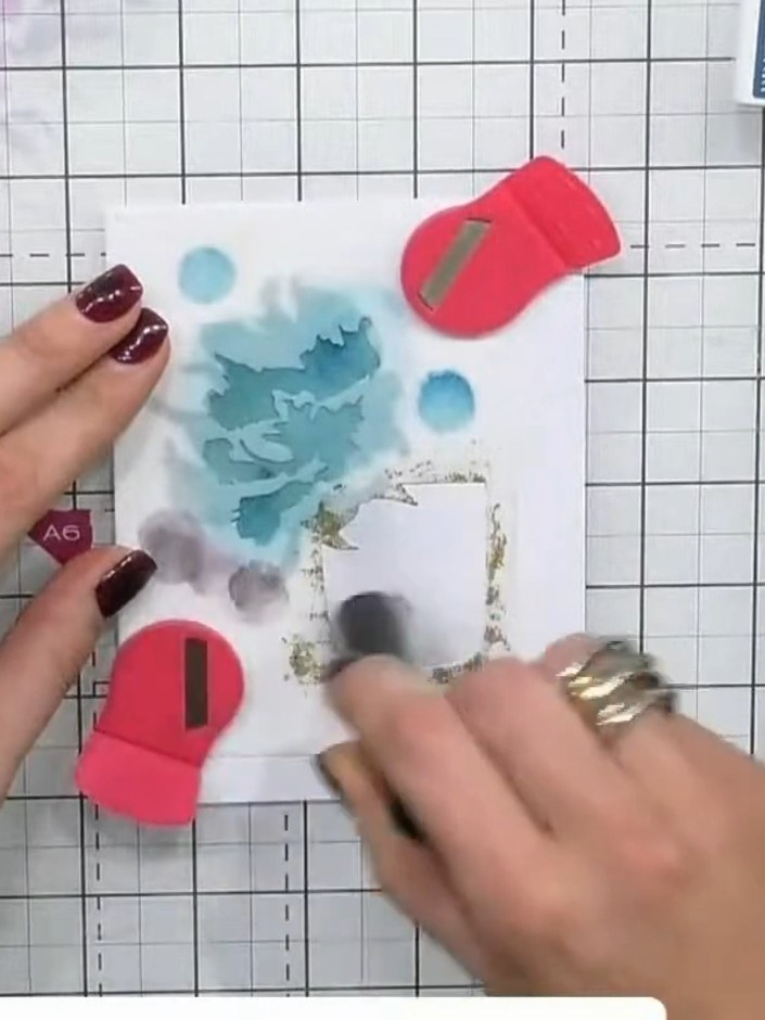 Step 4: Using the second stencil layer, apply a darker or heathery colour ink through the stencil onto the perfume bot