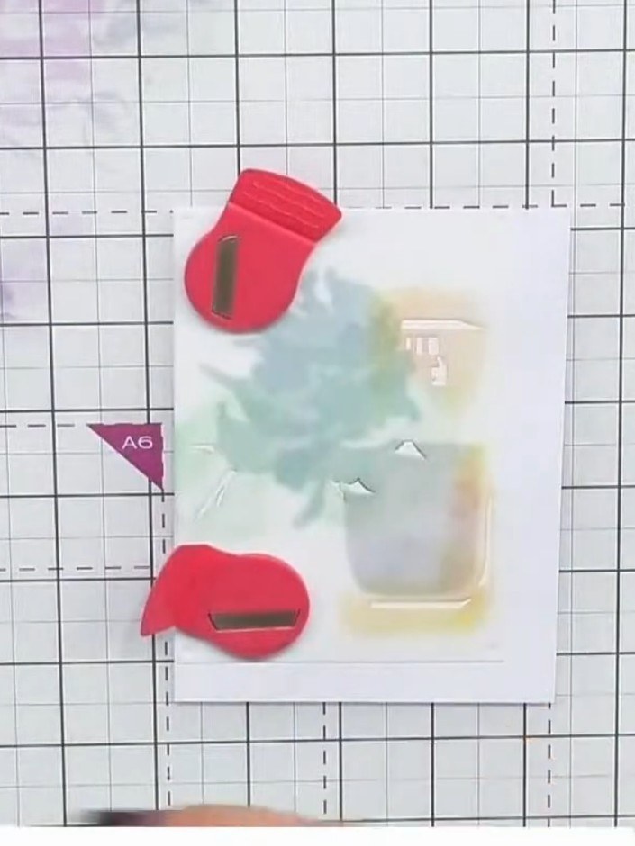 Step 5: Position stencil number three over your design and apply additional colour using the ink pads to complete the 