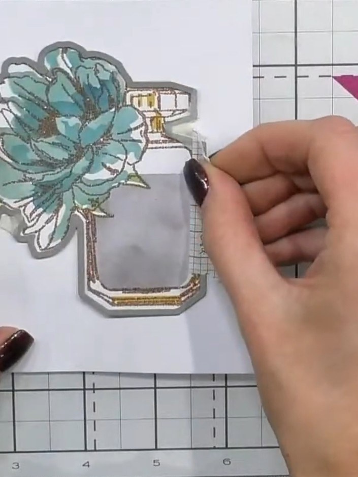 Step 9: Run the die-cut perfume bottle through your die-cutting machine to cut out the shape cleanly from the white ca
