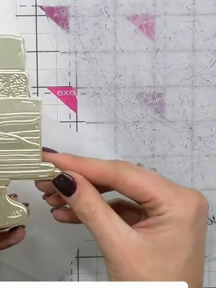 Step 3: Place the aligned die-cut gold cake piece onto your cutting platform and run it through your die-cutting machi