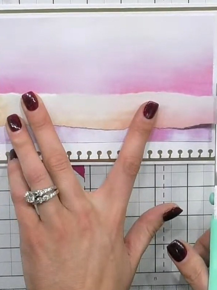 Step 3: Cut a piece of pink cardstock to match the size of your watercolour pattern paper. Layer the pink cardstock on