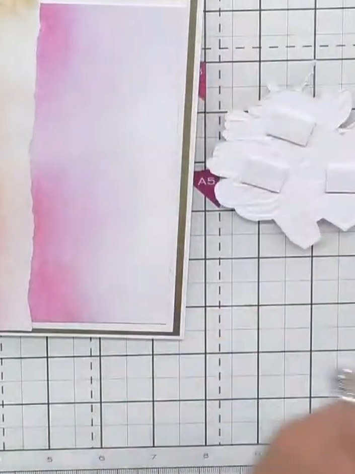 Step 6: Position the pressed flowers die-cut on the card front, placing it off-centre to the right for a balanced comp