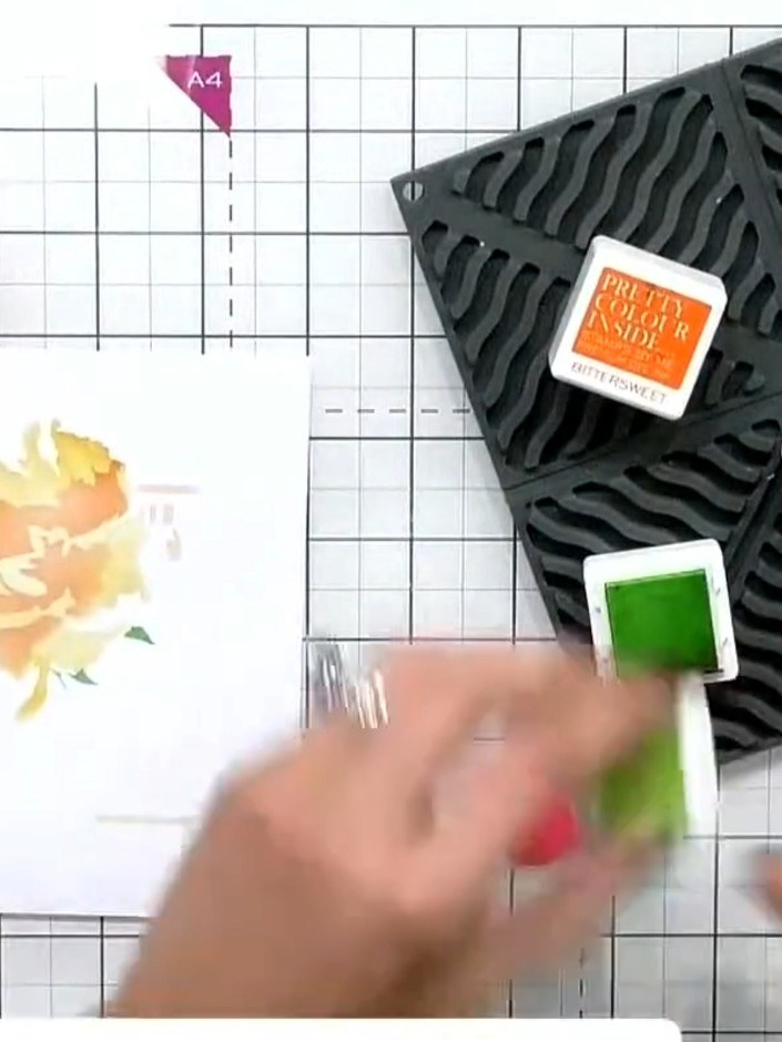 Step 5: Apply light green ink through the zebra stencil to colour the greenery and leaf elements of the perfume bottle
