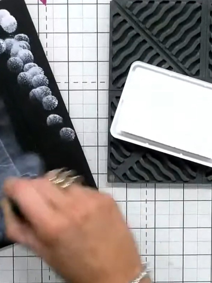 Step 2: Stamp the cake design onto the black card using white hybrid ink. Press firmly and evenly to ensure good ink t