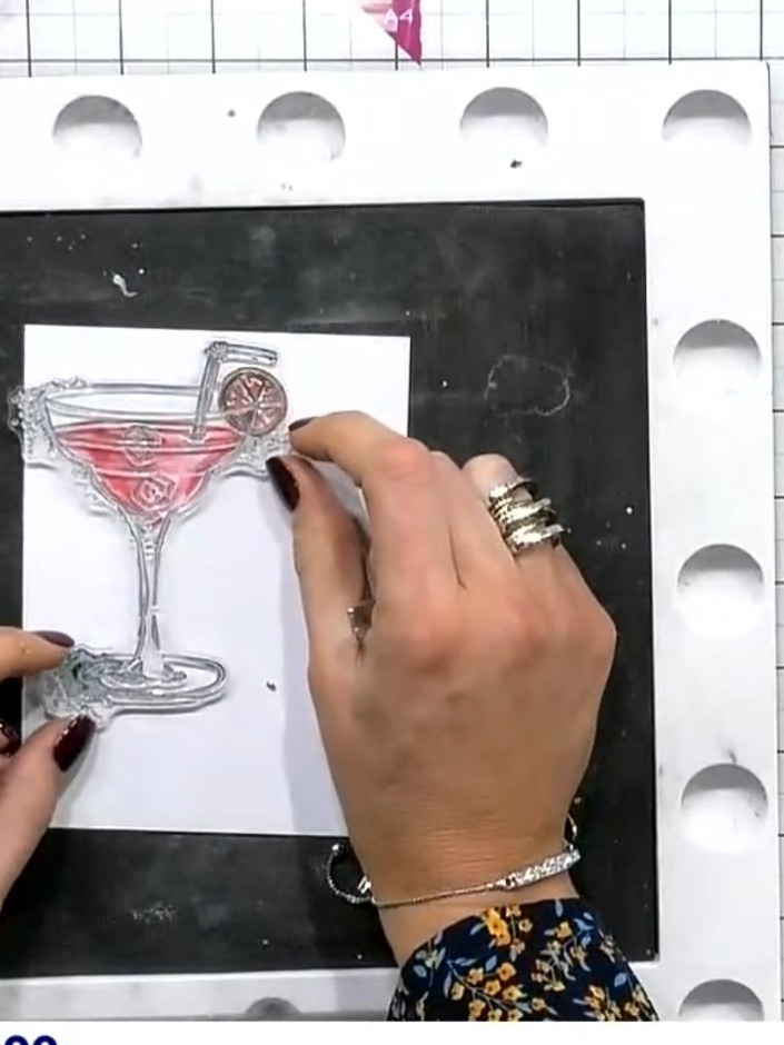 Step 4: Stamp the artistic splat design using a black ink pad to create the liquid and splash elements inside the cock