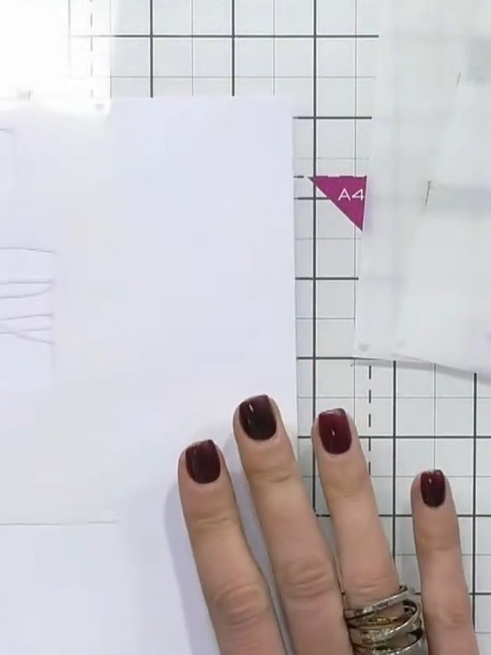 Step 1: Place stencil number one in the corner of your A4 white cardstock. Hold it in place with magnets on your glass