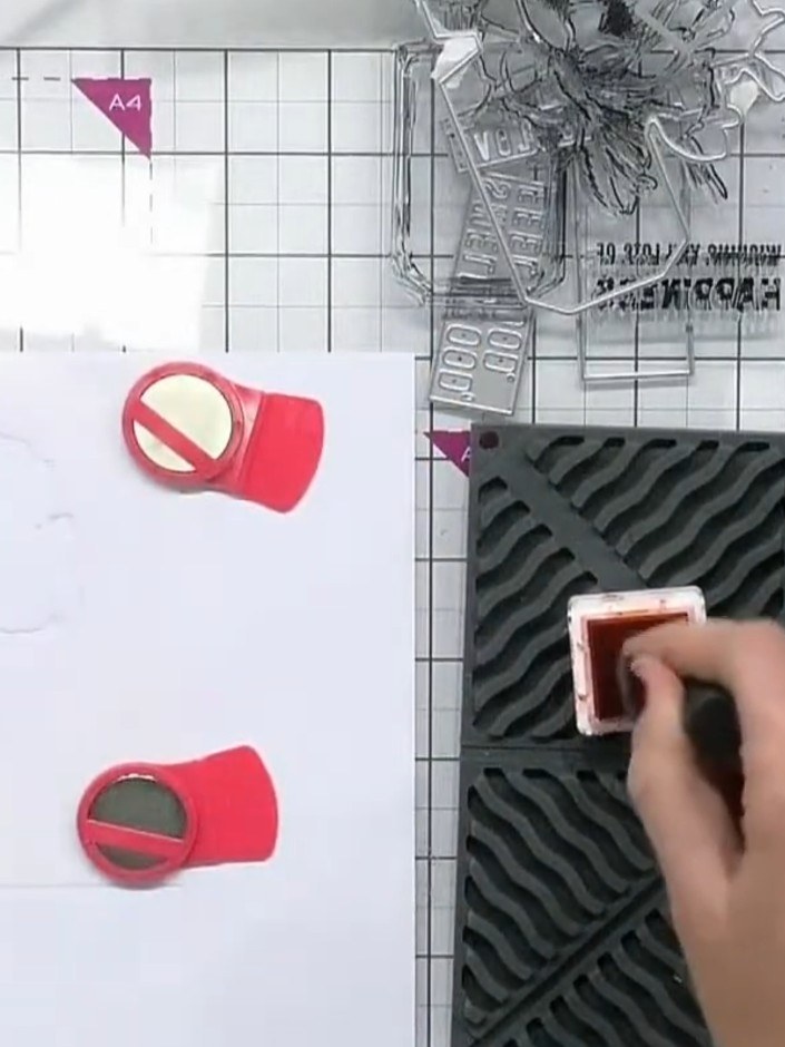 Step 2: Apply orange ink through the first stencil layer onto white card to create the base layer of the perfume bottl