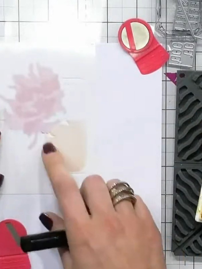 Step 5: Stamp the perfume bottle design onto the watercoloured panel using black ink to outline and define all the det