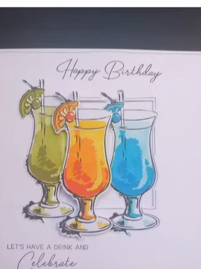 Step 9: Mount the completed cocktail glass panel onto your card base using adhesive. Position it centrally on the blac