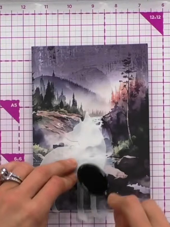 Step 1: Place the wolf mask image slightly offset on your card, positioning it towards the bottom or wherever you wish