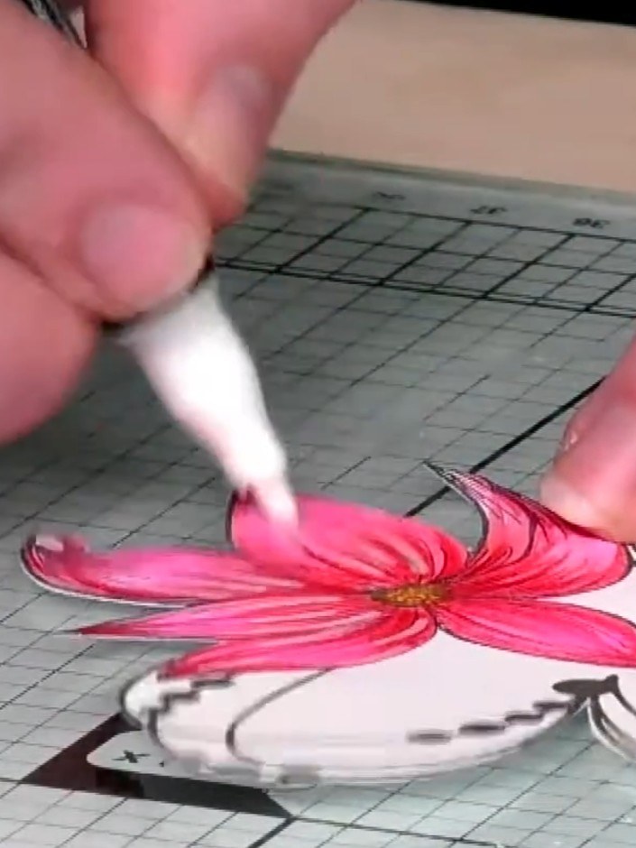 Step 4: Dry brush white acrylic paint around the edges of the vellum panel to make the colours pop further. Use a ligh