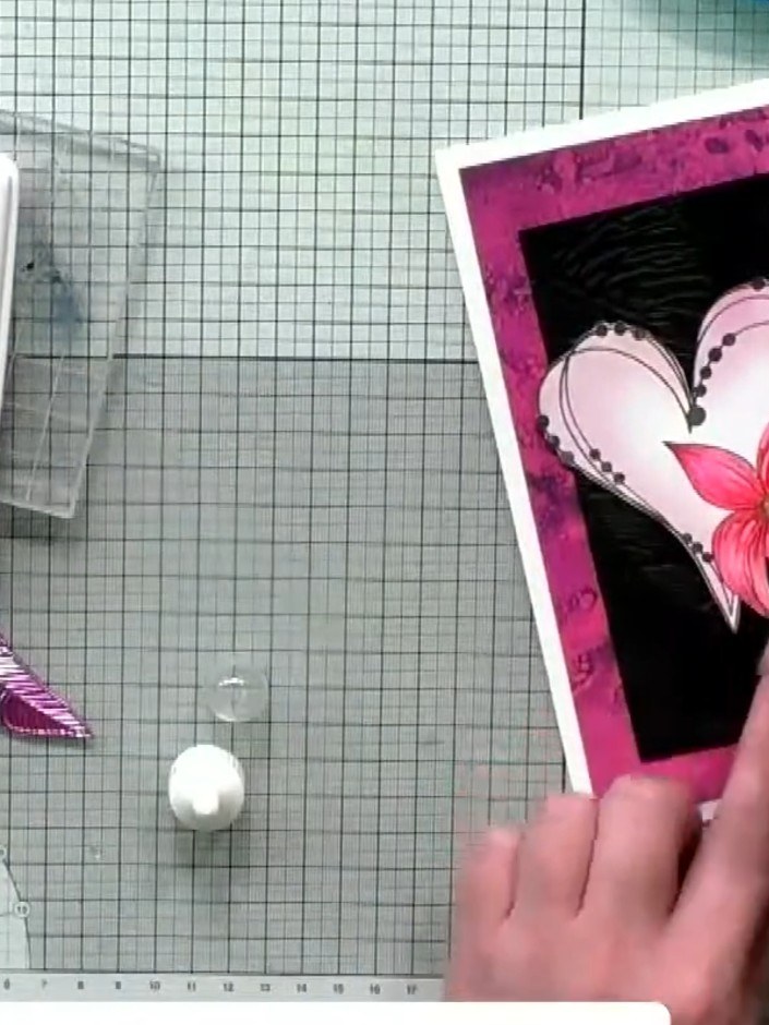Step 1: Stamp the heart design onto white card stock using magenta hybrid ink. Position the stamp centrally on the car