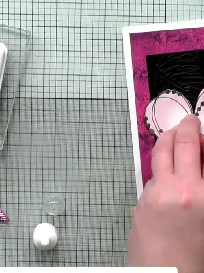 Step 2: Fussy cut carefully around the stamped heart design using scissors, following the outline closely to create a 