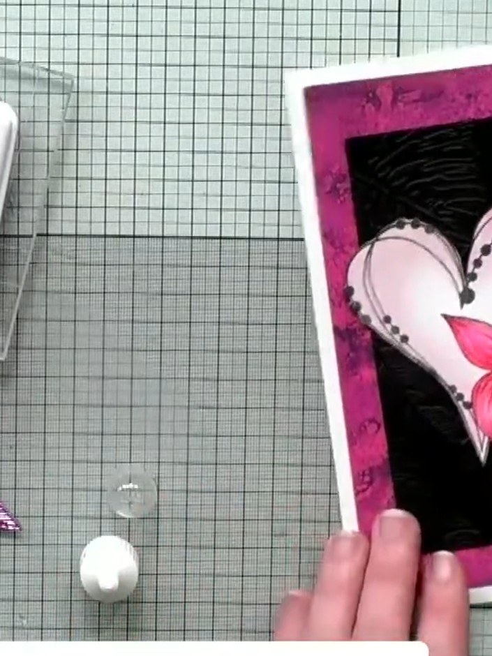 Step 3: Colour the heart using magenta ink from your stamp pad, applying the colour to match the pink background paper