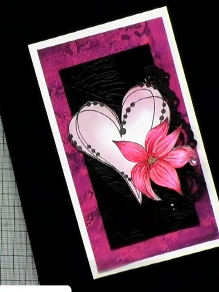 Step 5: Mount the fussy-cut heart element onto black card stock. Add a sentiment stamp or die-cut down the side of the
