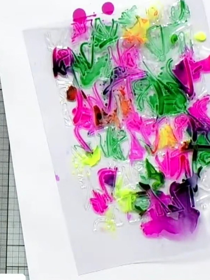 Step 6: Layer the finished embossed and coloured acetate piece over black or white card stock to display the vibrant d
