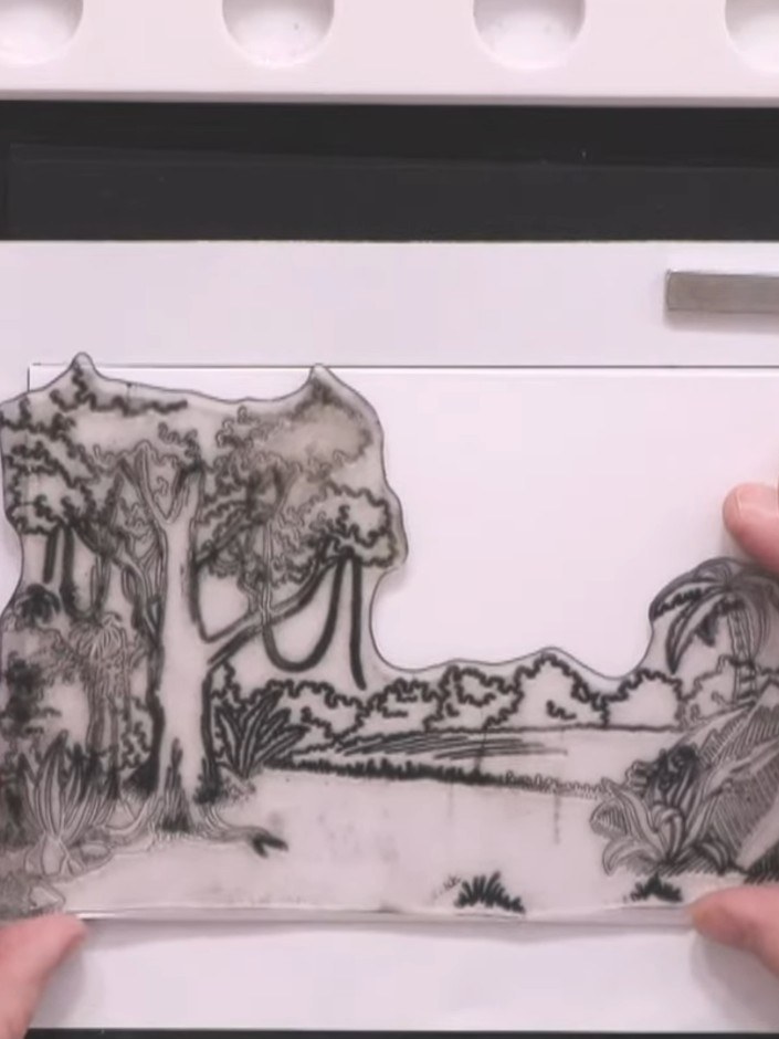 Step 2: Stamp the dinosaur background image onto your white card blank using black ink. Position the stamp so the tree