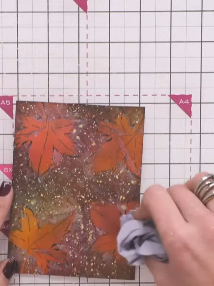 Step 12: Mount the finished embossed leaf panel onto your card base using adhesive. Hold in place and allow to dry comp