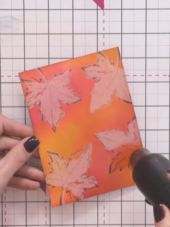 Step 7: Heat set the embossing powder with a heat gun, moving it over the surface until the powder melts and becomes c