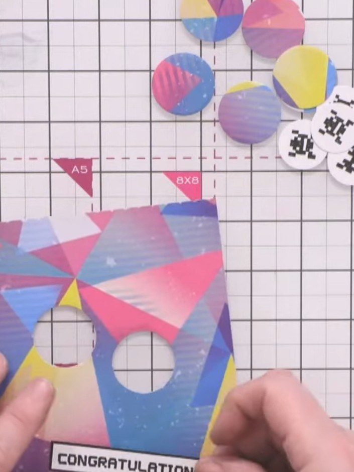 Step 10: Adhere the sentiment panel to a piece of coordinating coloured paper that complements the geometric circles on