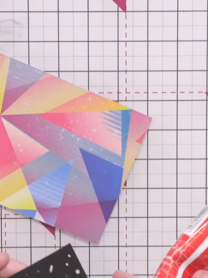 Step 5: Apply glue around the edges of the colourful geometric die-cut panel. Secure it onto the front of a white card
