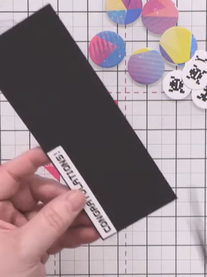 Step 8: Stamp the congratulations sentiment onto white card using black ink from the Stamps By Me Premium Hybrid Ink p