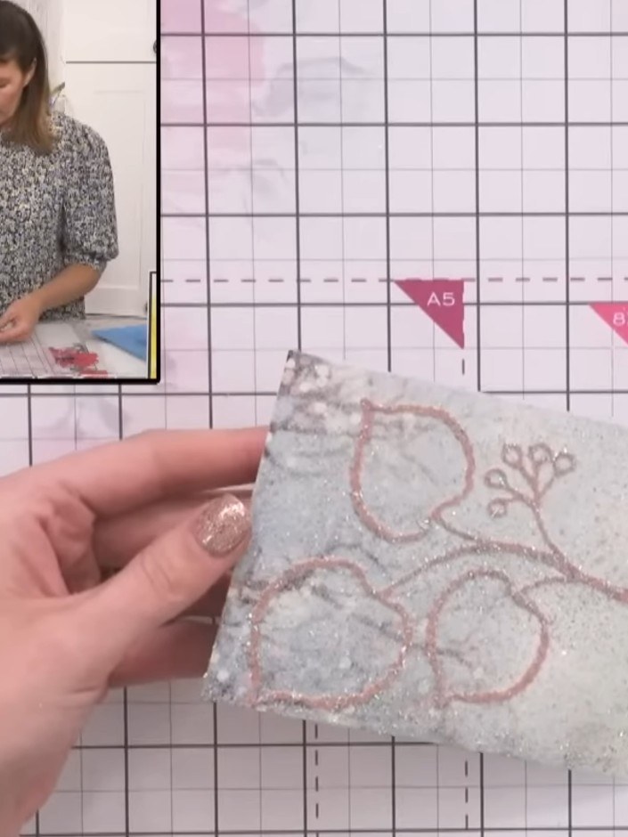 Step 8: Allow the embossed and glittered card to cool completely before handling. The heat-embossed design needs time 