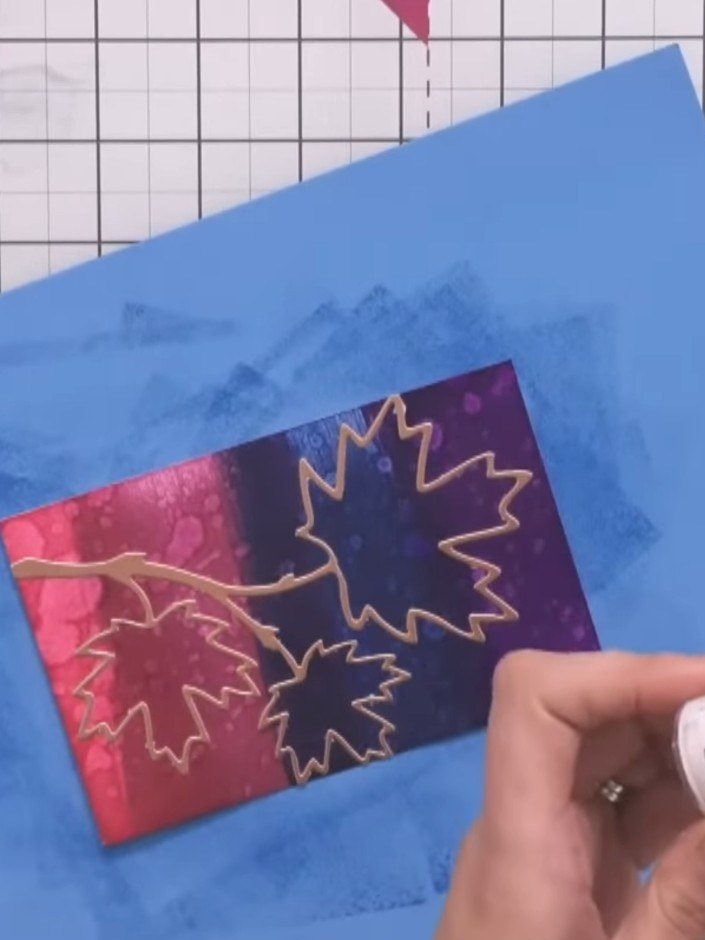 Step 9: Sprinkle ultra-thick clear embossing powder generously over the heat-embossed leaf design, ensuring all the in