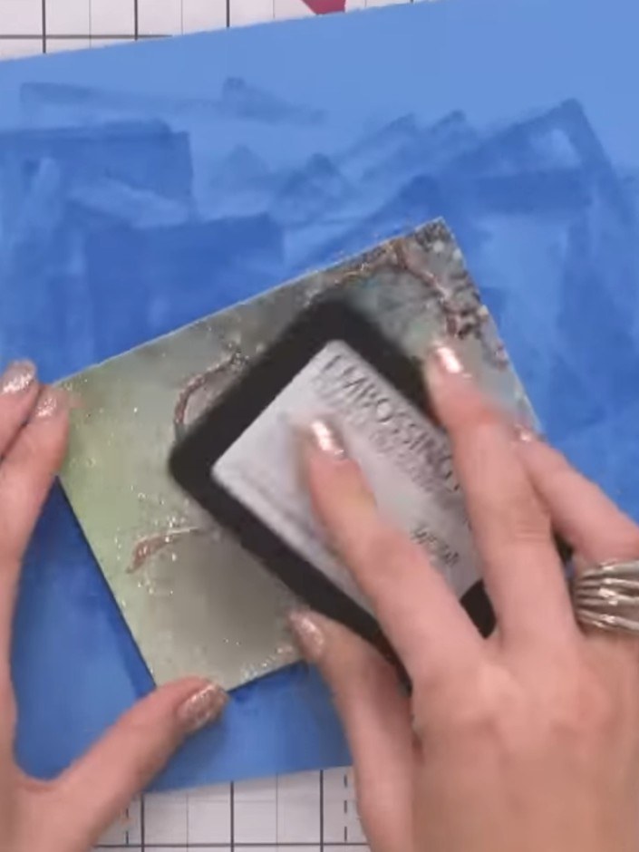 Step 1: Cut a panel of black card to use as your mounting base. This will form the foundation for your embossed design