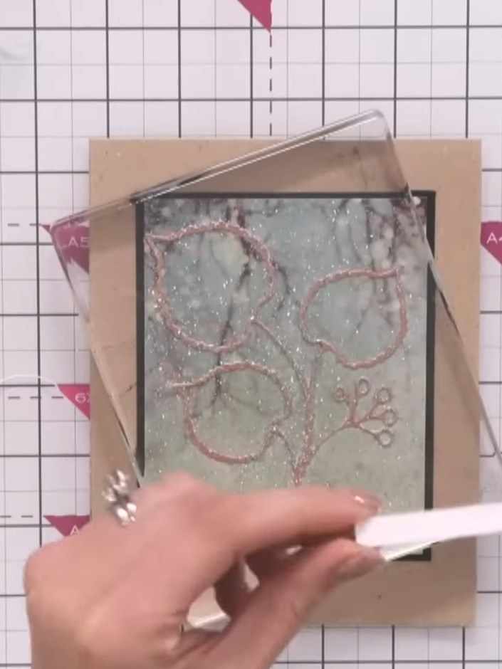 Step 7: Mount the finished embossed panel onto your card blank using adhesive. Position it centrally on the card front