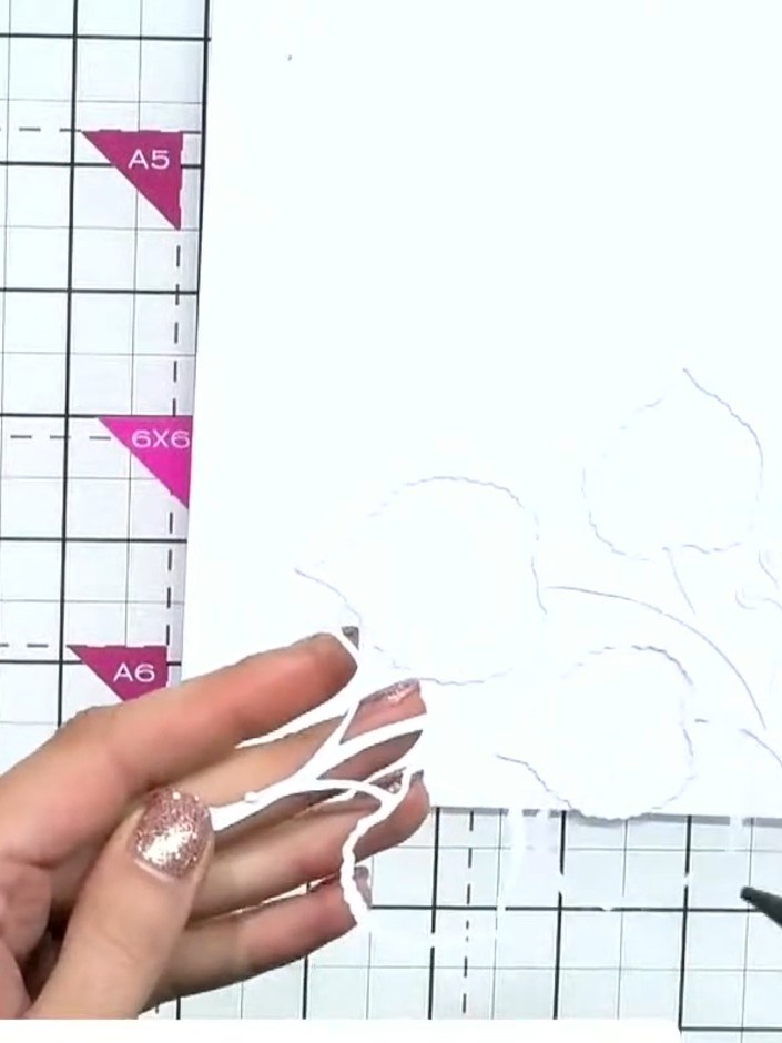 Step 3: Trim the excess white die-cut pieces and reposition them to fill in any void areas on your design, creating a 
