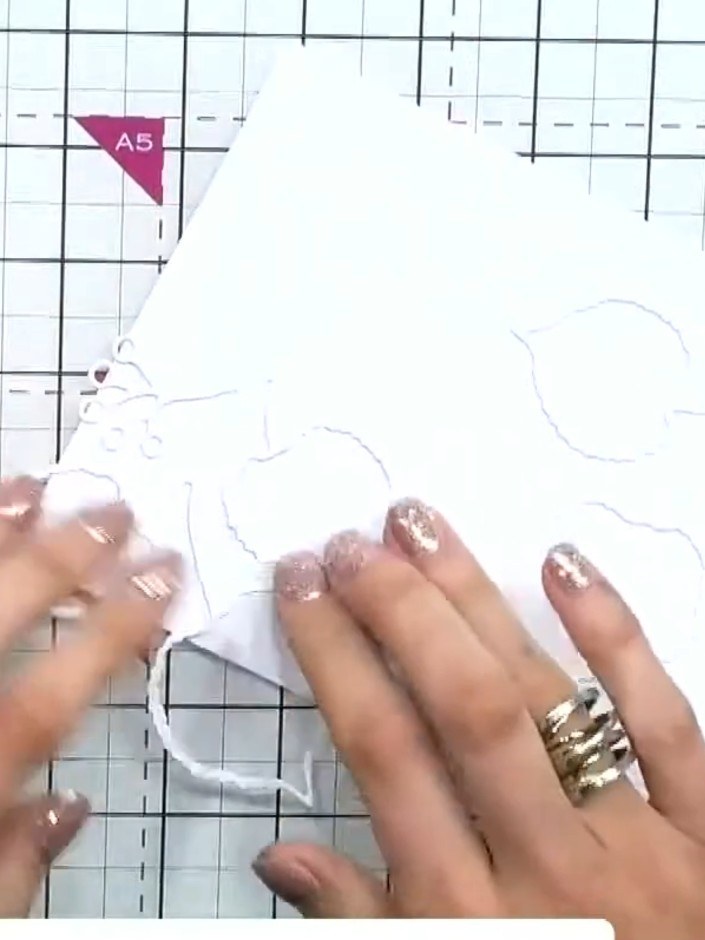 Step 4: Check that all the die-cut pieces are completely adhered to the card front, pressing down any edges that may h