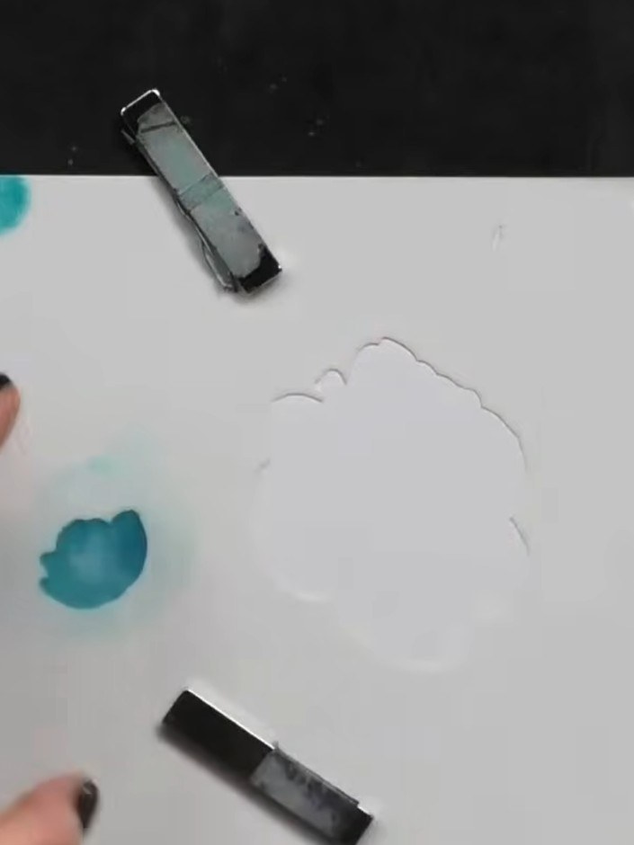 Step 3: Lift the first stencil carefully. Line up the second stencil (marked number 2) over your blended ink, using th
